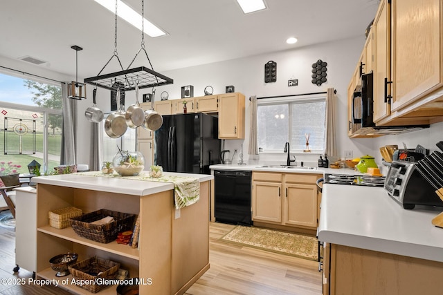 100 Limberpine Cir, Parachute, CO 81635 - kitchen with black appliances, light brown cabinetry, light wood-style floors, light countertops, and recessed lighting