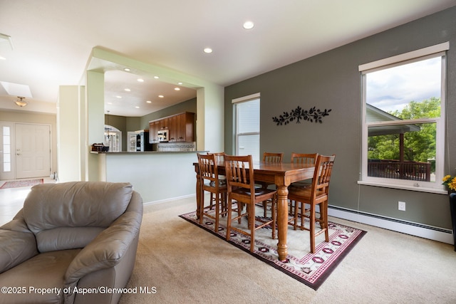50 N Ridge Ct, Battlement Mesa, CO 81635 - dining space with light colored carpet, healthy amount of natural light, recessed lighting, and a baseboard heating unit