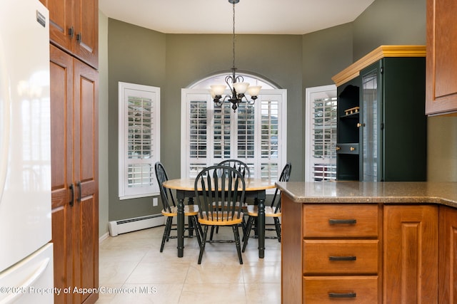 50 N Ridge Ct, Battlement Mesa, CO 81635 - dining room featuring a chandelier, light tile patterned floors, and baseboard heating