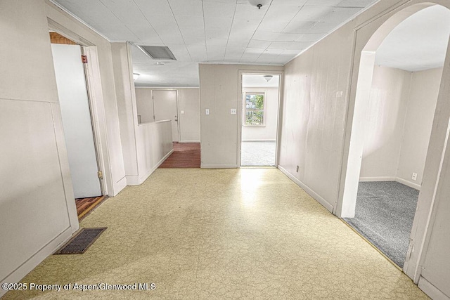 415 Tucker St, Craig, CO 81625 - hallway featuring arched walkways and baseboards