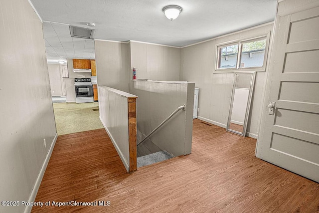 415 Tucker St, Craig, CO 81625 - hall with an upstairs landing, baseboards, and wood finished floors