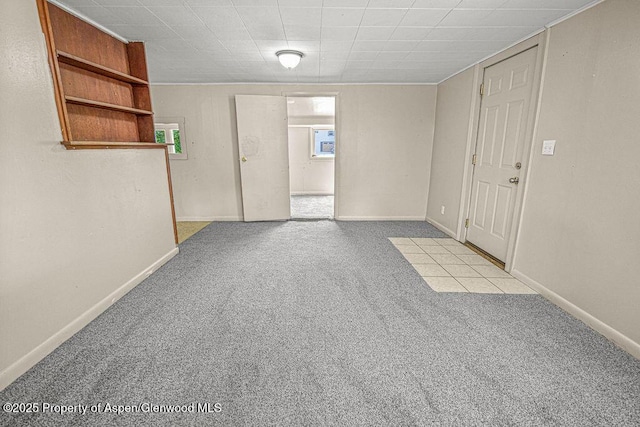 415 Tucker St, Craig, CO 81625 - spare room with carpet flooring, baseboards, and plenty of natural light