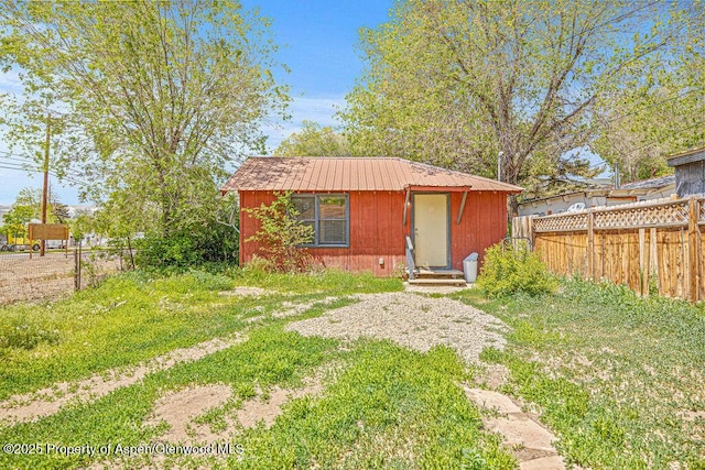 415 Tucker St, Craig, CO 81625 - view of front of house featuring metal roof and an outbuilding