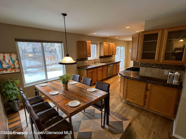 dining area with light hardwood / wood-style floors and sink