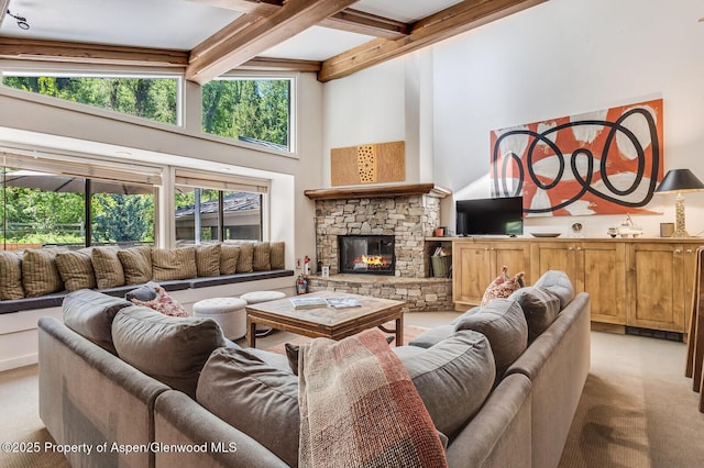851 Ute Ave Unit B, Aspen, CO 81611 - living area featuring carpet flooring, beam ceiling, a high ceiling, a fireplace, and coffered ceiling