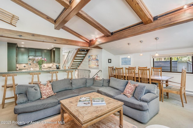 851 Ute Ave Unit B, Aspen, CO 81611 - living room with light carpet, beamed ceiling, high vaulted ceiling, and stairs