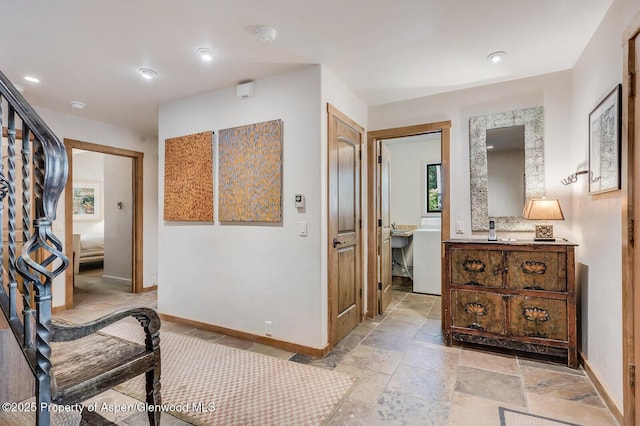 851 Ute Ave Unit B, Aspen, CO 81611 - hallway with recessed lighting, washer / dryer, and stone tile flooring