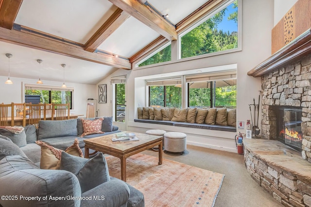 851 Ute Ave Unit B, Aspen, CO 81611 - living room with carpet floors, high vaulted ceiling, beam ceiling, and a stone fireplace