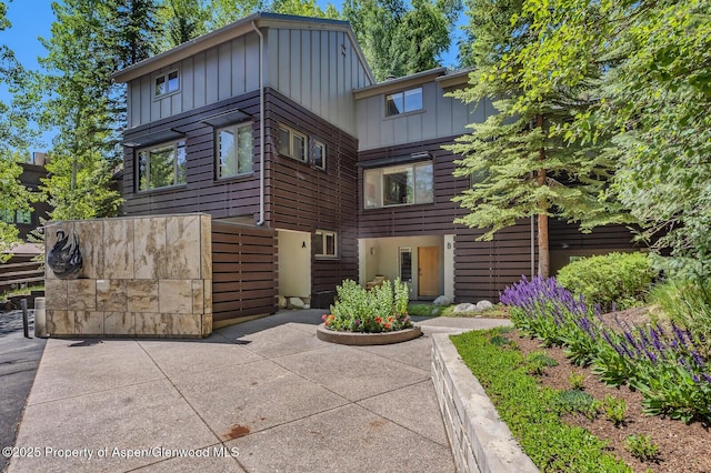 851 Ute Ave Unit B, Aspen, CO 81611 - contemporary house featuring board and batten siding and a patio area