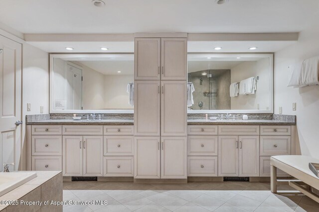 851 Ute Ave Unit B, Aspen, CO 81611 - bathroom featuring double vanity, a stall shower, tile patterned floors, recessed lighting, and a relaxing tiled tub