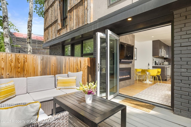 250 S Original St Unit B, Aspen, CO 81611 - wooden deck featuring an outdoor living space