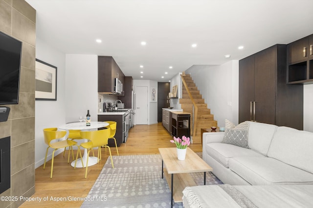250 S Original St Unit B, Aspen, CO 81611 - living area with light wood finished floors, stairs, and recessed lighting