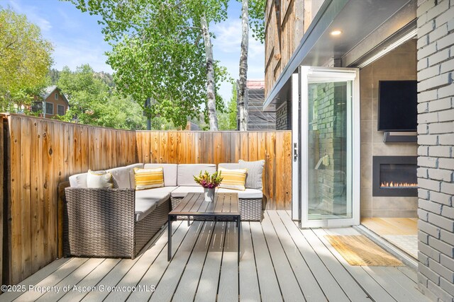 250 S Original St Unit B, Aspen, CO 81611 - deck with an outdoor living space and a fenced backyard