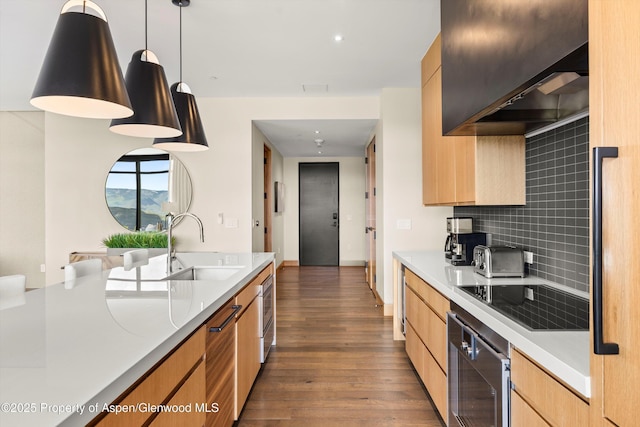 77 Wood Rd Unit 507-13, Snowmass Village, CO 81615 - kitchen featuring black electric cooktop, light countertops, backsplash, and dark wood-style floors