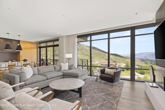 77 Wood Rd Unit 507-13, Snowmass Village, CO 81615 - living area featuring expansive windows and wood finished floors