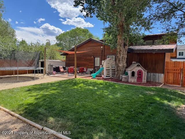 763 Tucker St, Craig, CO 81625 - view of yard with a trampoline and a patio area