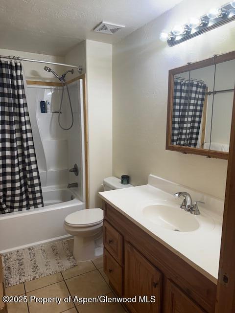 763 Tucker St, Craig, CO 81625 - bathroom featuring vanity, tile patterned flooring, and shower / bathtub combination with curtain