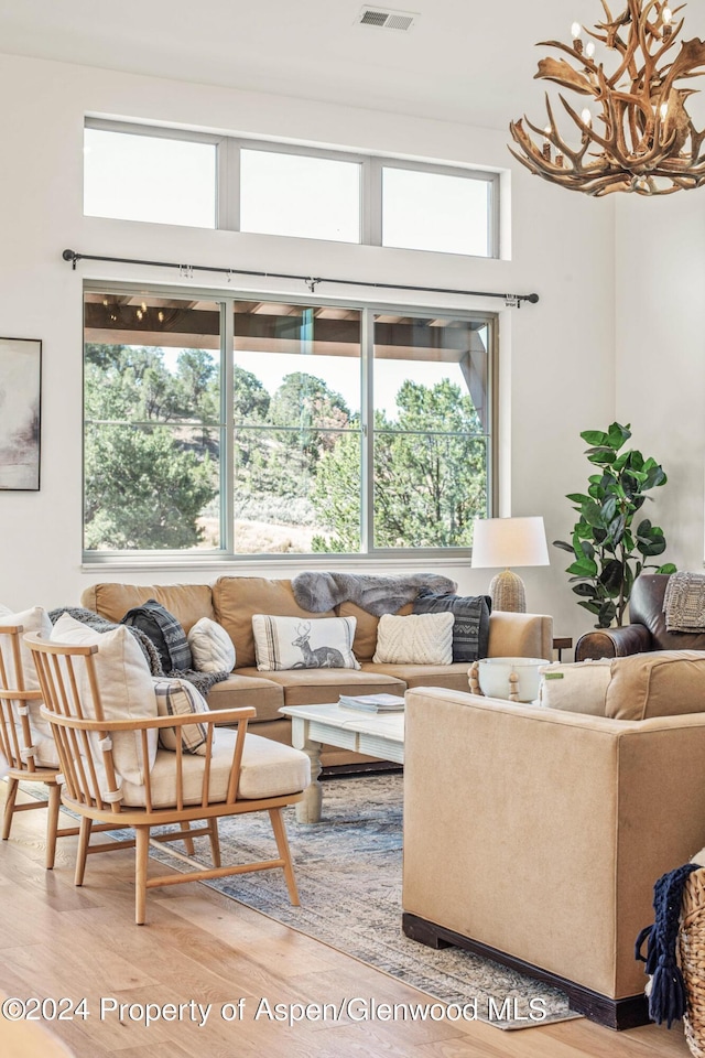 living room with hardwood / wood-style flooring and a wealth of natural light