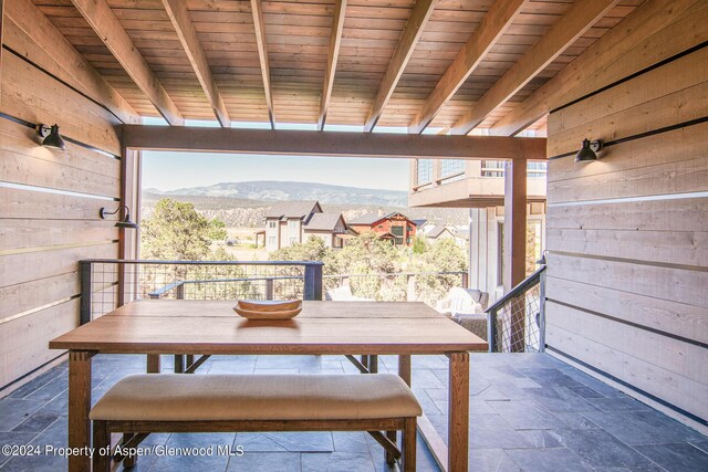 view of patio / terrace with a mountain view and a balcony