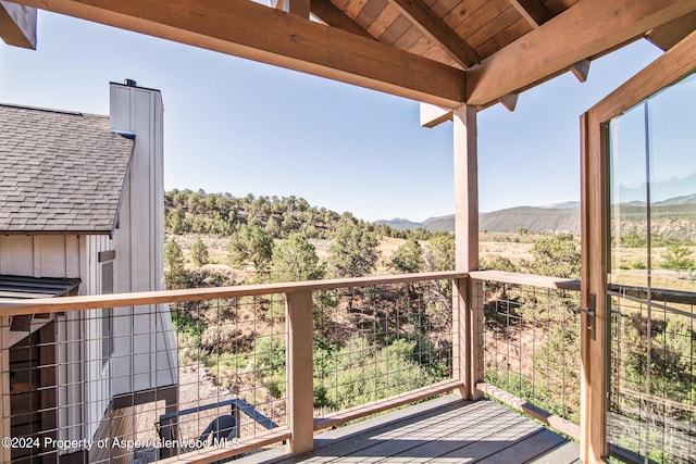 wooden deck featuring a mountain view