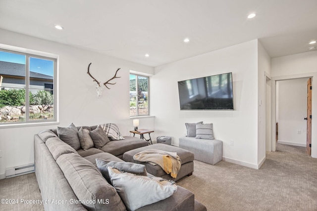 carpeted living room with baseboard heating