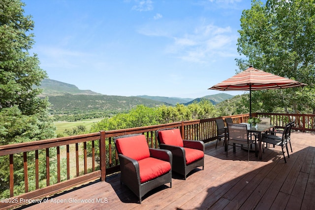 1436 Hooks Spur Rd, Basalt, CO 81621 - deck featuring a mountain view and outdoor dining space