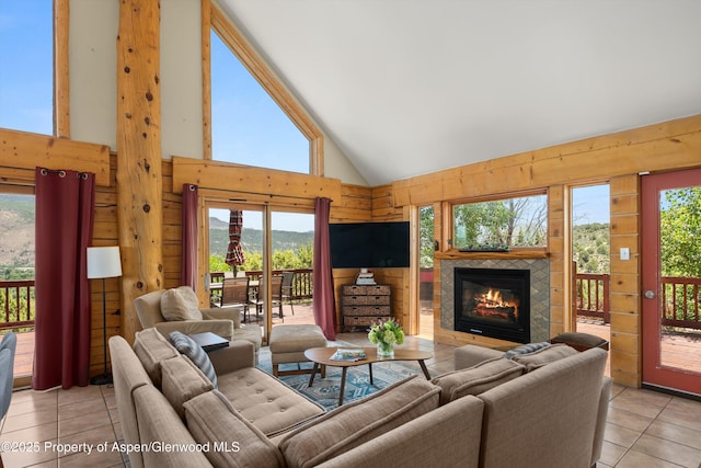 1436 Hooks Spur Rd, Basalt, CO 81621 - living area with light tile patterned floors, a tile fireplace, and high vaulted ceiling