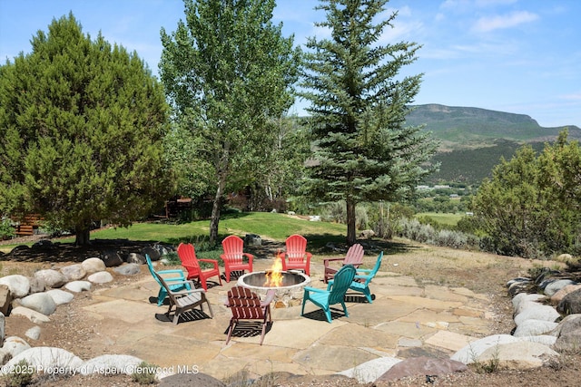 1436 Hooks Spur Rd, Basalt, CO 81621 - view of patio / terrace with a fire pit and a mountain view