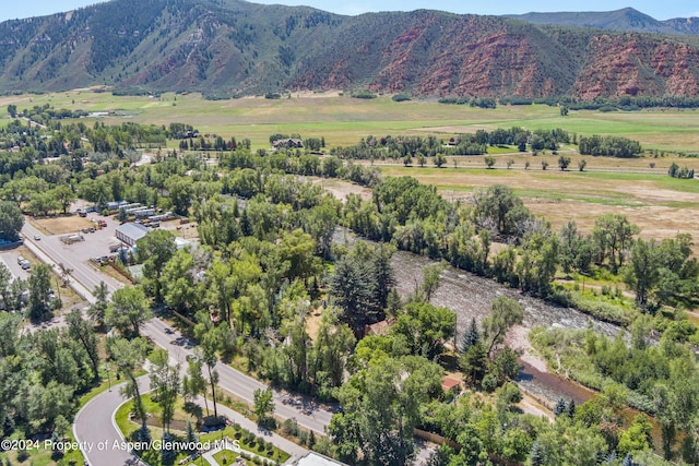 birds eye view of property with a mountain view