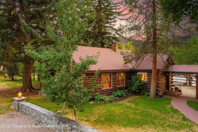 cabin featuring a yard