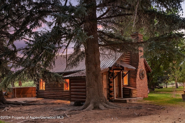 view of property exterior at dusk