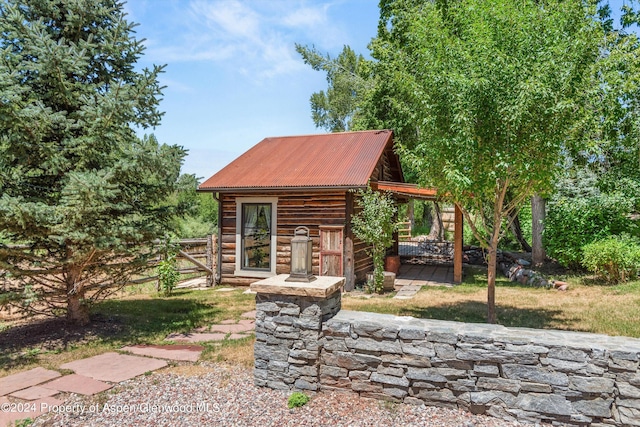 view of front of property with an outbuilding