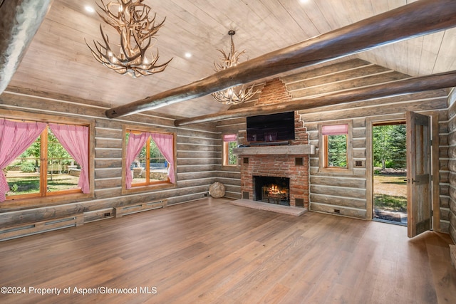 unfurnished living room with hardwood / wood-style floors, log walls, wooden ceiling, and a brick fireplace