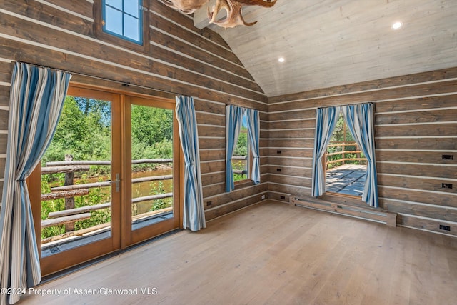 unfurnished sunroom featuring wood ceiling and vaulted ceiling