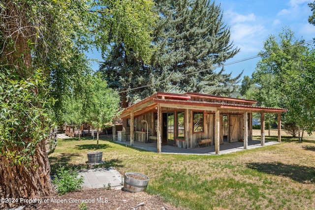 view of community with an outdoor structure