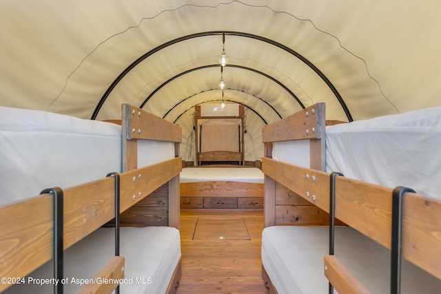 bedroom with hardwood / wood-style flooring