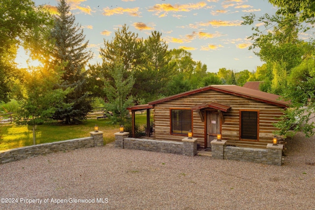 log home featuring a lawn