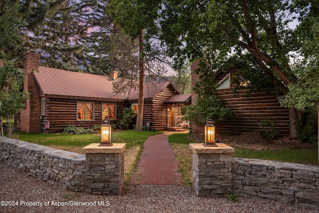 view of log cabin