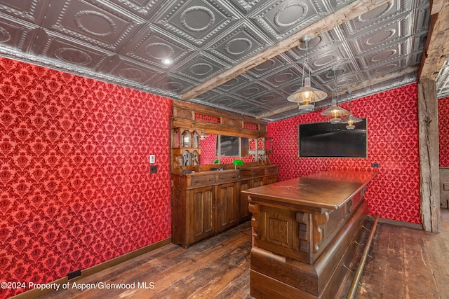 bar with hardwood / wood-style floors