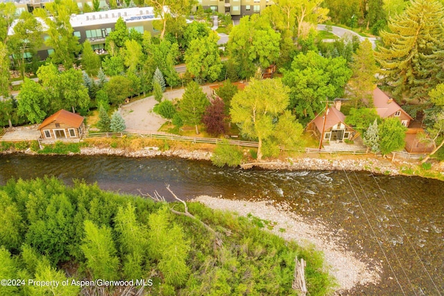 birds eye view of property featuring a water view