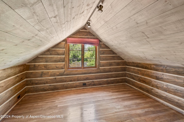 bonus room featuring wood walls, wooden ceiling, and hardwood / wood-style flooring