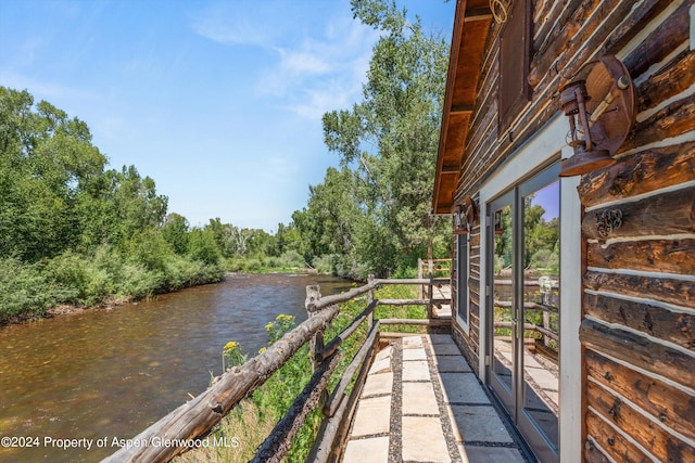 balcony featuring a water view