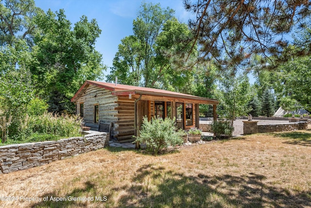 exterior space with a lawn