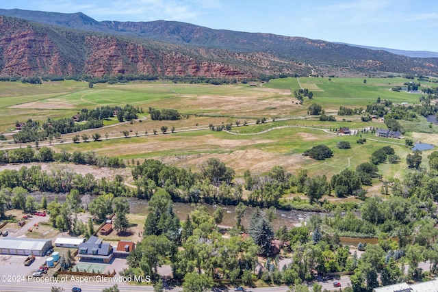 drone / aerial view featuring a mountain view