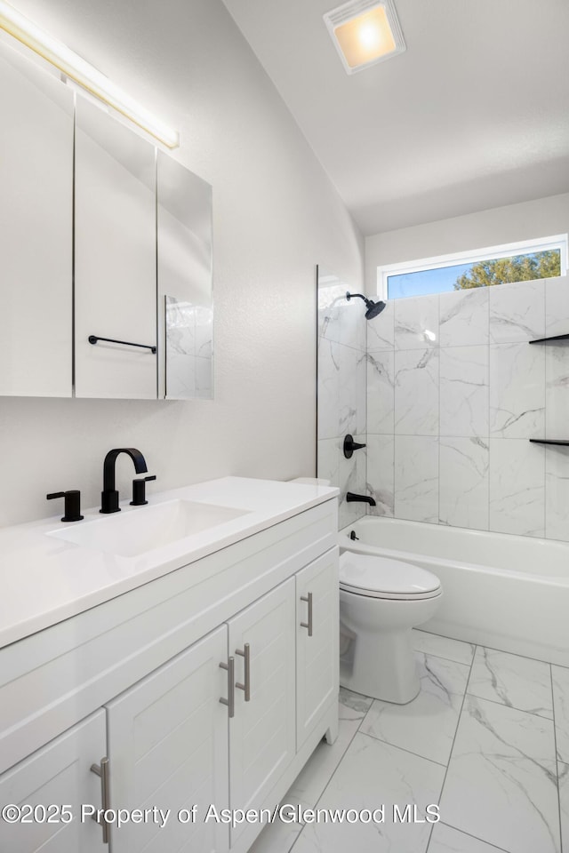 full bathroom featuring shower / bath combination, vanity, and toilet