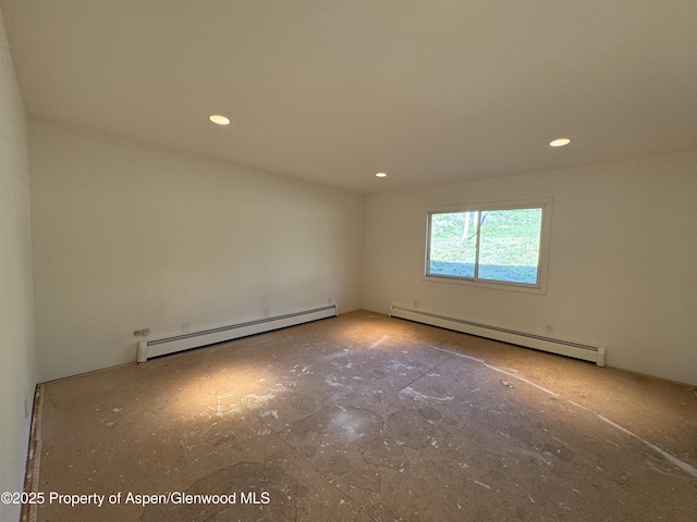 empty room featuring baseboard heating