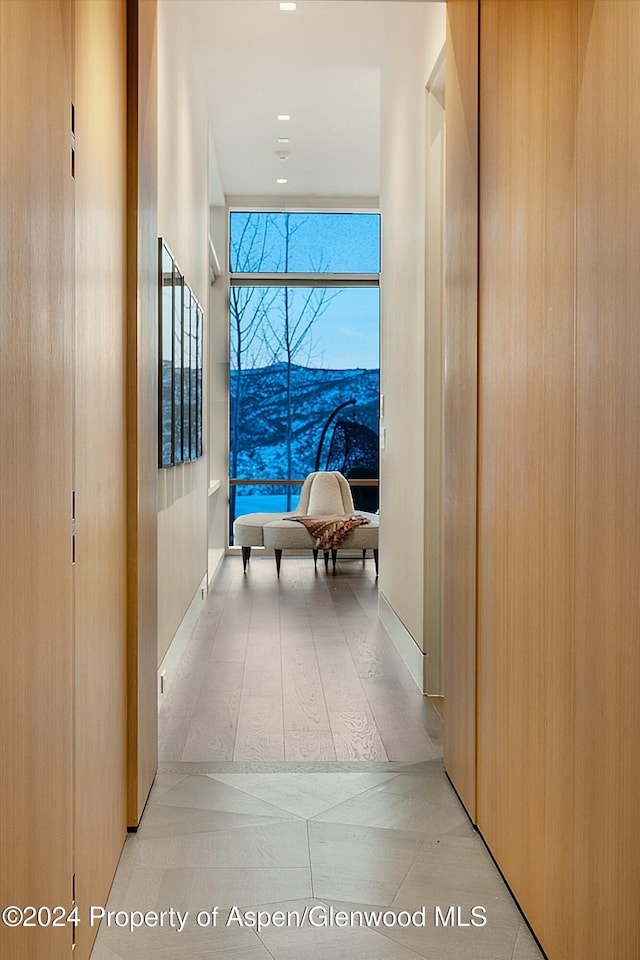 hallway featuring light tile patterned floors