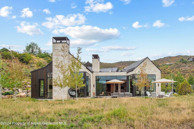 387 Branding Ln, Snowmass Village, CO 81615 - back of house featuring a chimney and a mountain view