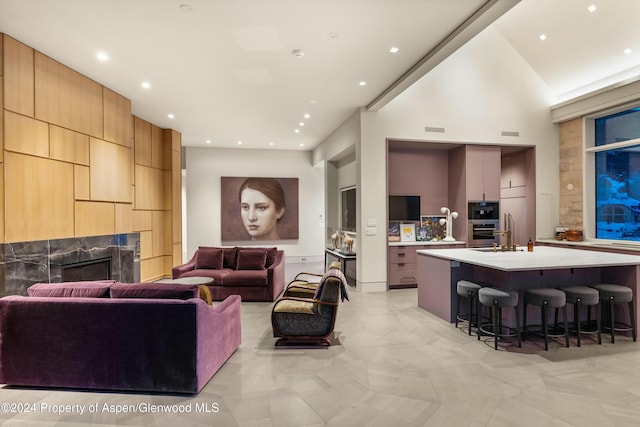 living room with a high ceiling