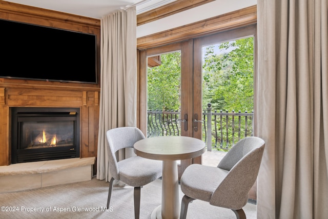 415 E Dean St Week 7 St, Aspen, CO 81611 - dining room with french doors, carpet flooring, and a lit fireplace